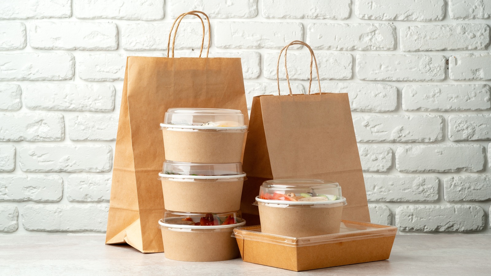 Take,Out,Food,In,Boxes,And,Craft,Bag,Against,Brick